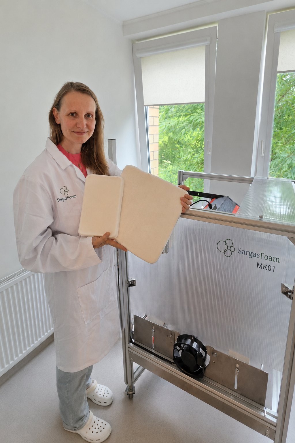 SargasFoam scientist holding a freshly produced foam slab at the MK01 production unit